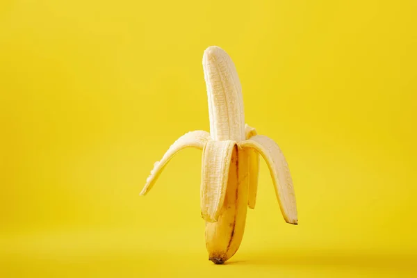 Close up view of ripe banana isolated on yellow — Stock Photo