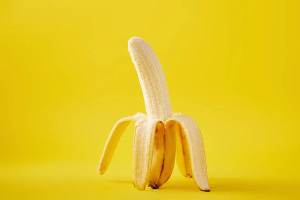 Close up view of ripe banana isolated on yellow — Stock Photo