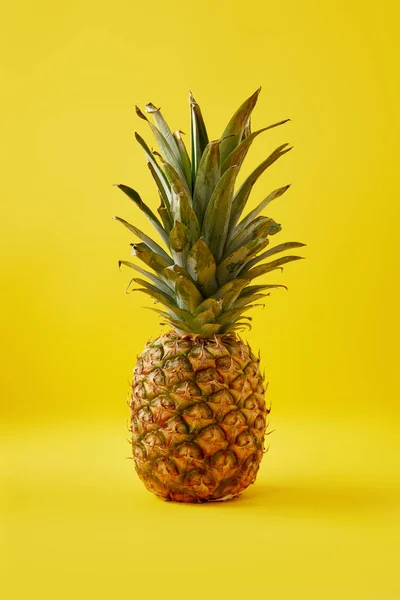 Close up view of fresh pineapple on yellow background — Stock Photo