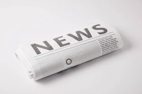 One daily newspaper lying on white background — Stock Photo