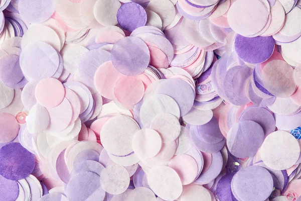 Close up of violet confetti pieces on surface — Stock Photo