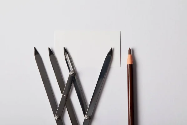 Top view of tools for permanent makeup and blank card on white — Stock Photo