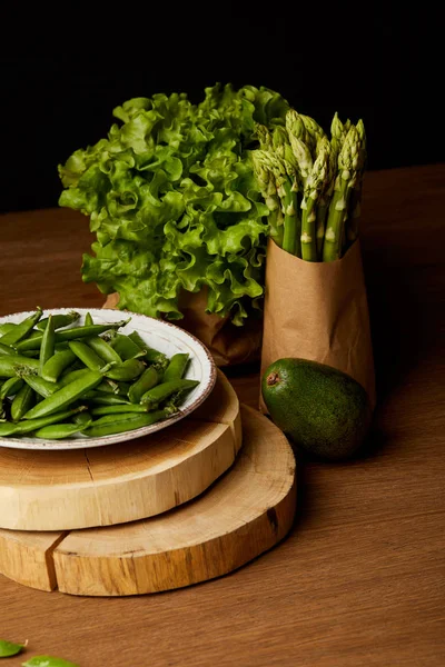 Healthy green vegetables on wooden tabletop — Stock Photo