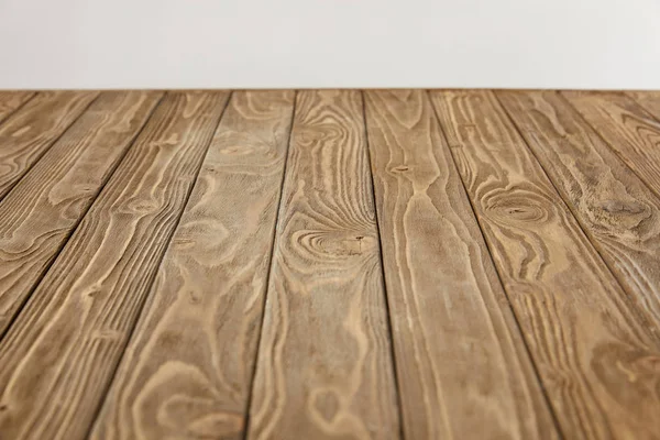 Empty wooden tabletop isolated on grey — Stock Photo