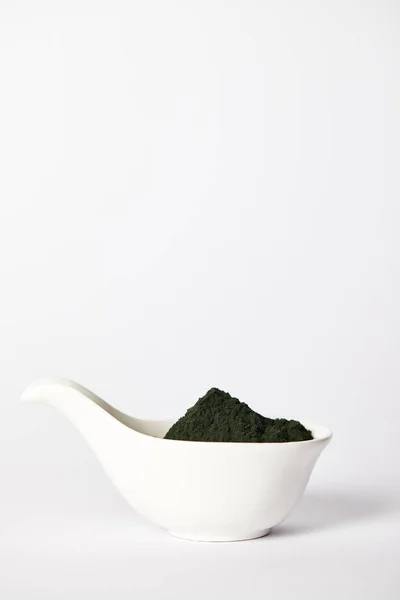 Spirulina algae powder in bowl isolated on grey background — Stock Photo