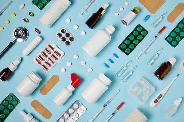 Full frame shot of composed various medical supplies on blue surface — Stock Photo