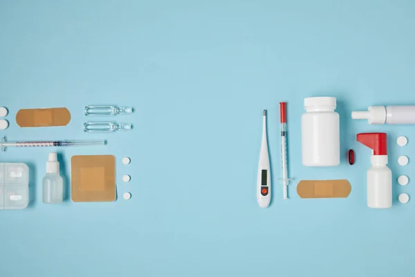 Top view of composed various medical supplies on blue surface — Stock Photo