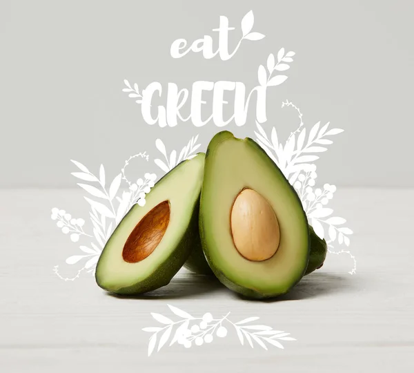 Organic green avocado, clean eating concept, eat green inscription — Stock Photo