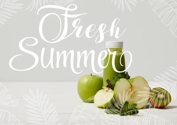 Green detox smoothie with apples, kiwi and mint and on white wooden surface, fresh summer inscription — Stock Photo