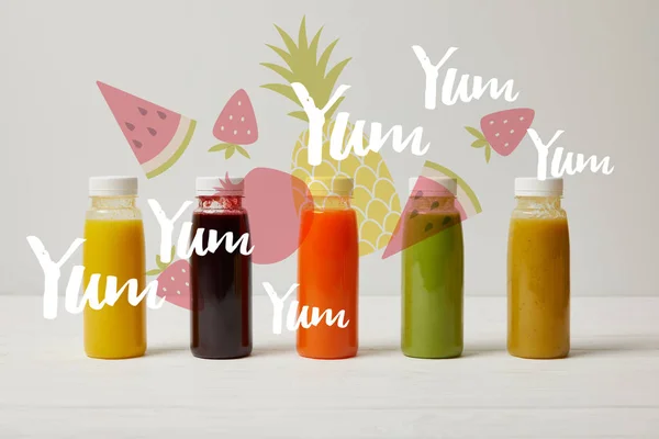 Detox smoothies in bottles standing in row, refresh concept, yum yum yum inscription — Stock Photo