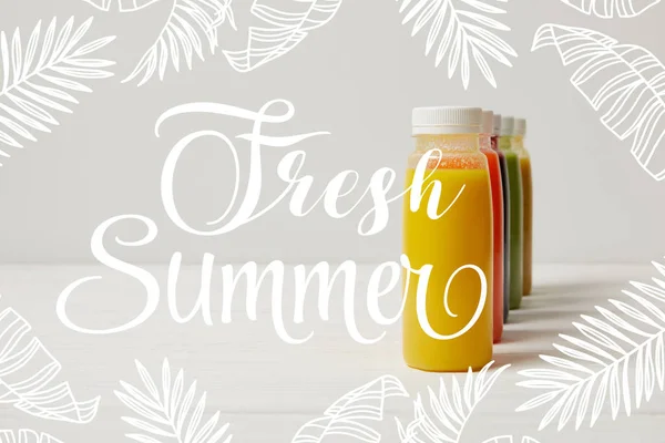 Organic detox smoothies in bottles standing in row, fresh summer inscription — Stock Photo