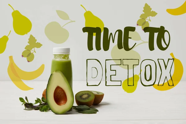 Smoothie with green avocado, kiwi and mint on white wooden surface, time to detox inscription — Stock Photo