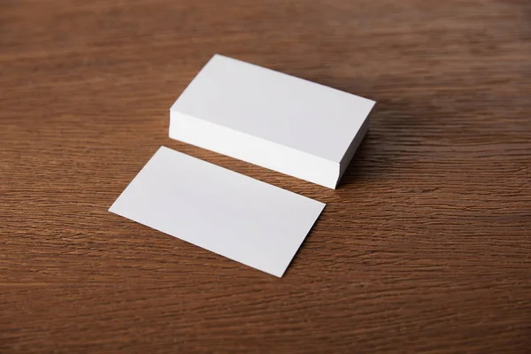 Selective focus of stack of empty business cards at wooden table — Stock Photo