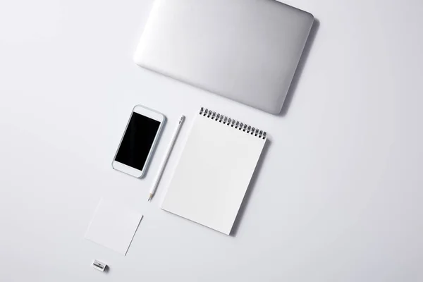 Top view of arranged various business workplace objects on white surface for mockup — Stock Photo