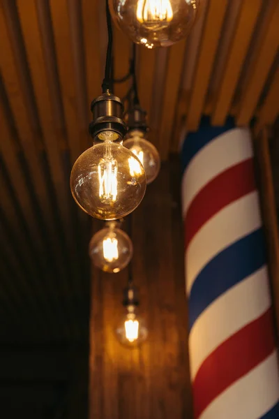 Close-up view of illuminated light bulbs in stylish loft interior — Stock Photo