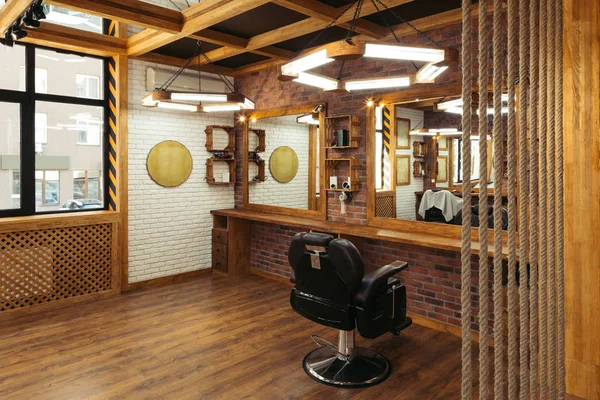 Stylish interior in empty modern professional barber shop — Stock Photo