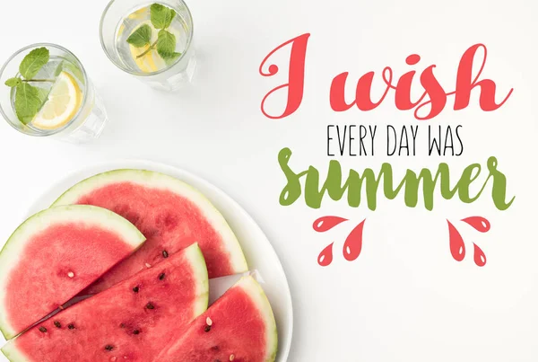 Top view of watermelon slices on plate and lemonade in glasses, with 