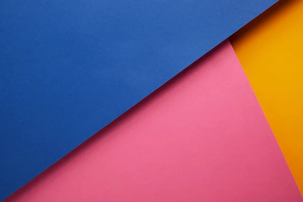 Background with blue, pink and yellow papers — Stock Photo