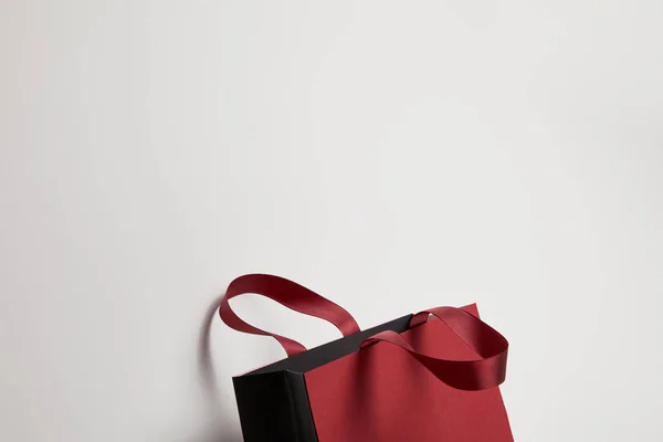 One beautiful burgundy shopping bag on white — Stock Photo