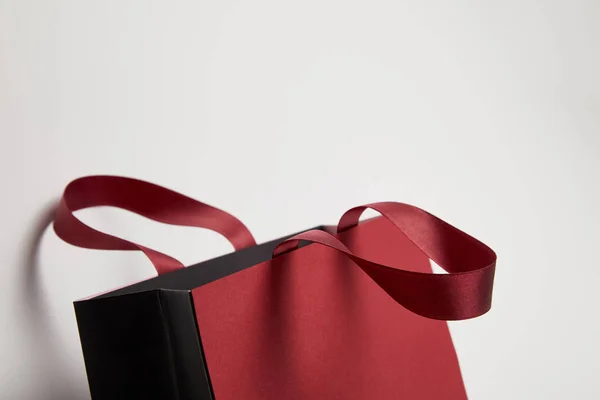 One new burgundy shopping bag on white — Stock Photo