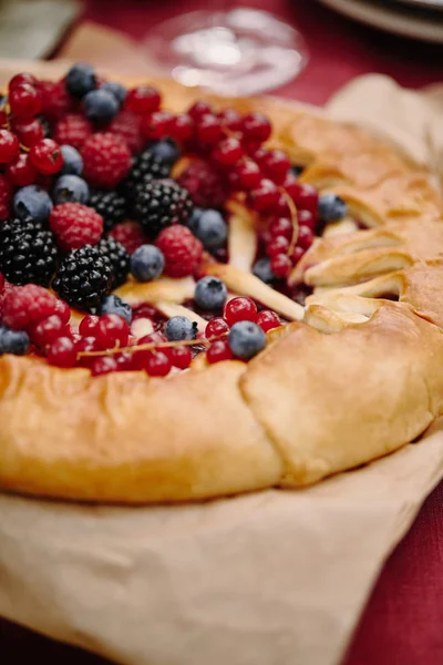 Yummy berries pie on table in garden — Stock Photo