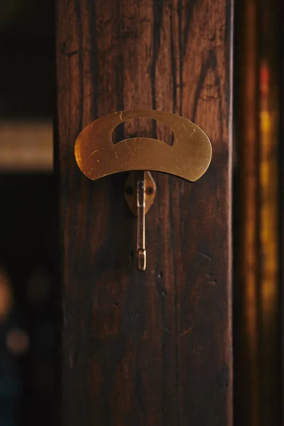 Close-up shot of clothes hanger on wooden wall — Stock Photo