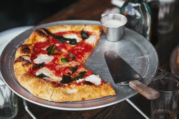 Close-up shot of trey with delicious pizza margherita on stand — Stock Photo