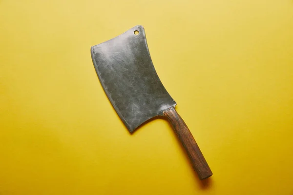 Sharp knife cleaver on yellow background — Stock Photo