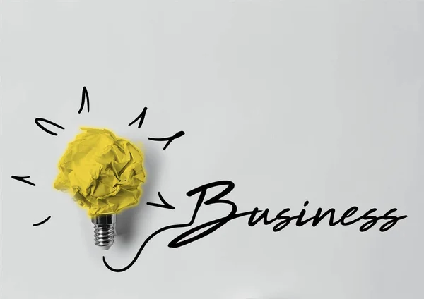 Top view of crumpled paper as light bulb with business lettering — Stock Photo