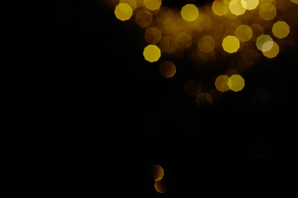 Abstract dark background with gold bokeh — Stock Photo