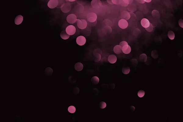 Purple decorative bokeh on black background — Stock Photo