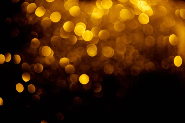 Abstract decorative background with blurred golden glitter — Stock Photo