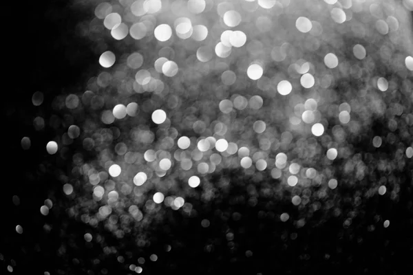 Fond lumineux abstrait avec des paillettes argentées floues — Photo de stock