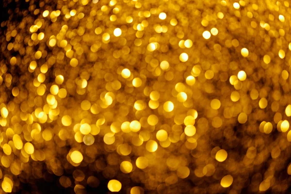 Abstract background with blurred gold glitter — Stock Photo