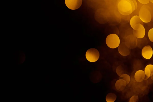 Abstract dark background with beautiful gold bokeh and copy space — Stock Photo