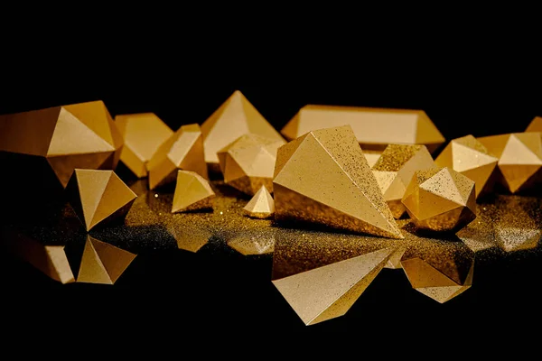 Close-up view of shiny golden glittering pieces of gold reflected on black — Stock Photo