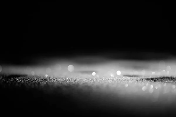 Astratto brillantini d'argento lucido su sfondo scuro — Foto stock