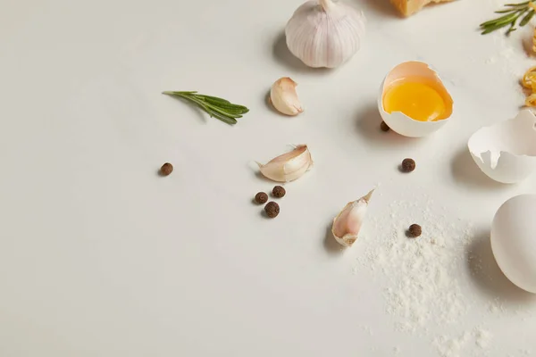 Close up view of ingredients for italian pasta on white marble surface — Stock Photo