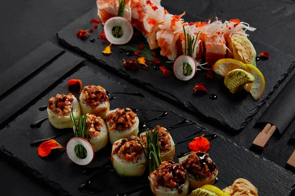Roll in mamenori with shrimp, salmon and avocado in sauce nigiri and roll with creamy eel and kimchi mayonnaise — Stock Photo