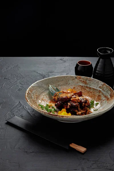 Gourmet traditional japanese gourmet on plate and chopsticks — Stock Photo