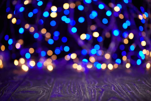 Wooden surface and sparkling background, christmas concept — Stock Photo