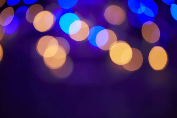 Beautiful blue and golden shiny bokeh christmas background — Stock Photo