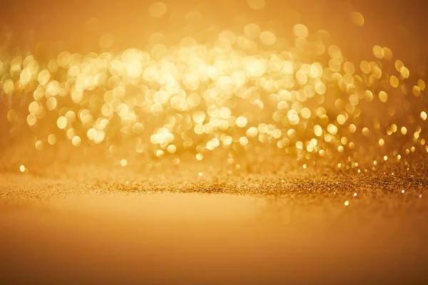 Bokeh christmas background with golden glitter — Stock Photo