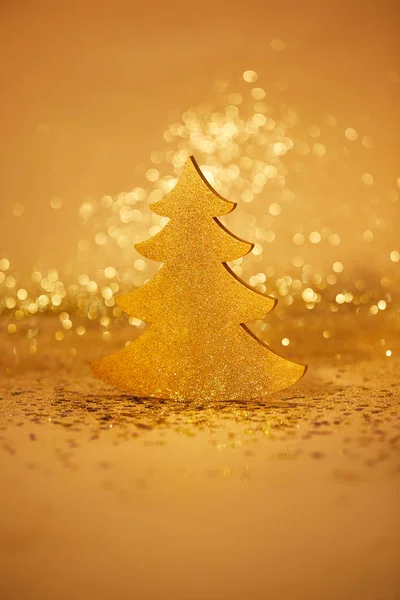 Golden shiny christmas tree for decoration with glitter — Stock Photo