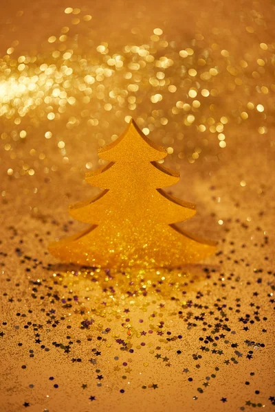 Golden festive christmas tree for decoration with glittering background — Stock Photo