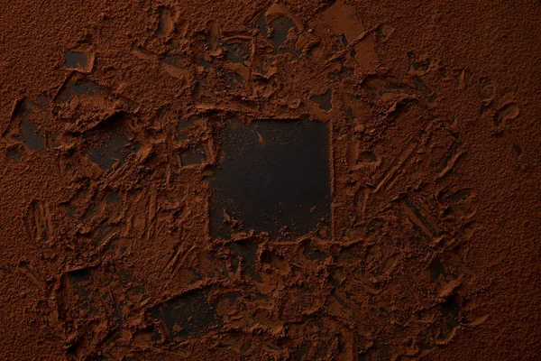 Top view of yummy cocoa powder on black background — Stock Photo