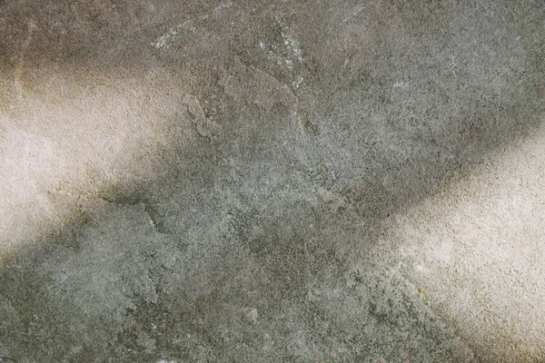 Grey shabby textured stone with sunlight — Stock Photo