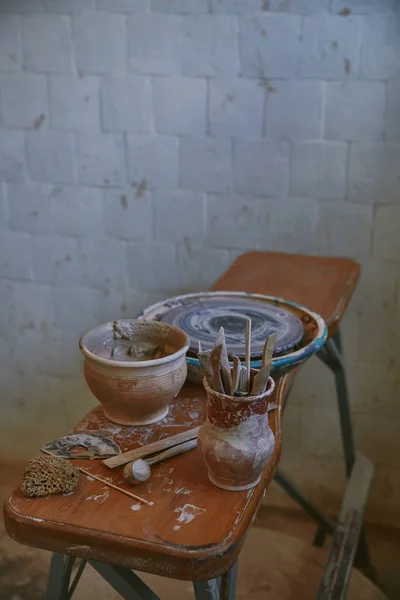 High angle view of pottery tools at table in pottery studio — Stock Photo