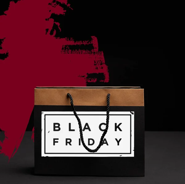 Close up view of paper shopping bag with black friday sale — Stock Photo