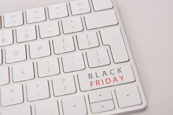 Close-up shot of computer keyboard with black friday button — Stock Photo